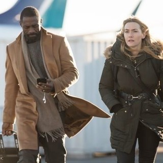 Idris Elba stars as Ben Bass and Kate Winslet stars as Alex Martin in 20th Century Fox's The Mountain Between Us (2017)