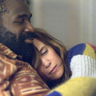 Tunde Adebimpe stars as Mo and Kristen Wiig stars as Polly in The Orchard's Nasty Baby (2015)