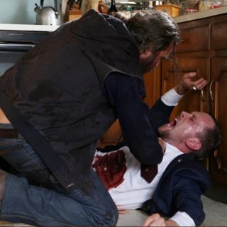 Joaquin Phoenix stars as Joe and Scott Price stars as Dying Gunman in Amazon Studios' You Were Never Really Here (2018)