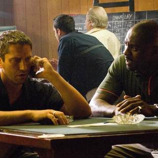 Gerard Butler stars as One Two and Idris Elba stars as Mumbles in Warner Bros Pictures' RocknRolla (2008)