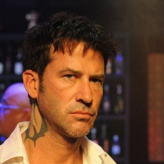 Joe Flanigan stars as Andrew Fayden in Motion Picture Corporation of America's Six Bullets (2013)