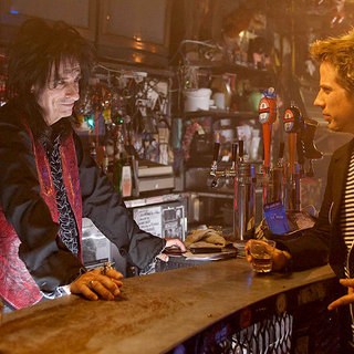 Henry Rollins stars as Rockin' Roger and Rob Stefaniuk stars as Joey in D&E Entertainment's Suck (2010)