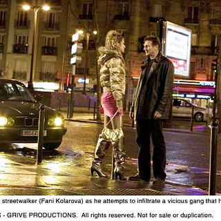 Fani Kolarova stars as Prostitute and Liam Neeson stars as Bryan Mills in The 20th Century Fox's Taken (2009). Photo credit by Stephanie Branchu.
