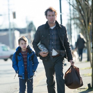 Jaeden Lieberher stars as Anthony and Clive Owen stars as Walt in Saban Films' The Confirmation (2016)