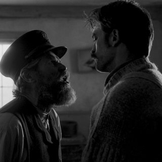 Willem Dafoe stars as Thomas Wake and Robert Pattinson stars as Ephraim Winslow in A24's The Lighthouse (2019)