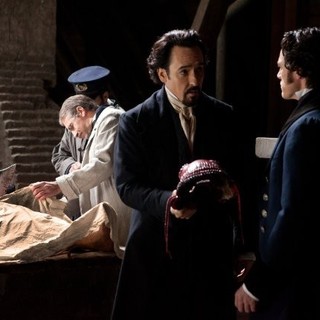 John Cusack stars as Edgar Allan Poe and Luke Evans stars as Detective Emmett Fields in Relativity Media's The Raven (2012)