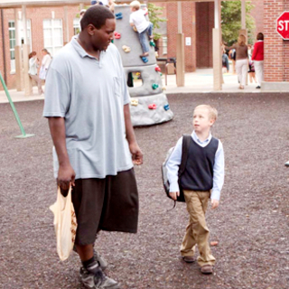 Quinton Aaron stars as Michael Oher and Jae Head stars as S.J. in The 20th Century Fox's The Blind Side (2009)