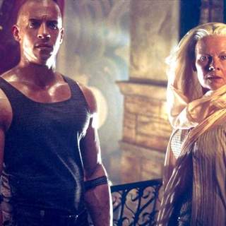 Vin Diesel and Judi Dench in Universal Pictures' The Chronicles of Riddick (2004)