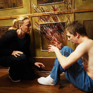 Virginia Madsen stars as Sara Campbell and Kyle Gallner stars as Matt Campbell in Gold Circle Films' The Haunting in Connecticut (2009)