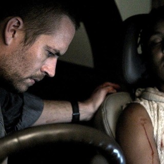 Paul Walker stars as Michael Woods and Naima McLean stars as Rachel Shabangu in Ketchup Entertainment's Vehicle 19 (2013)