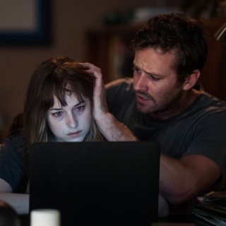 Dakota Johnson stars as Carrie and Armie Hammer stars as Will in Hulu' Wounds (2019)