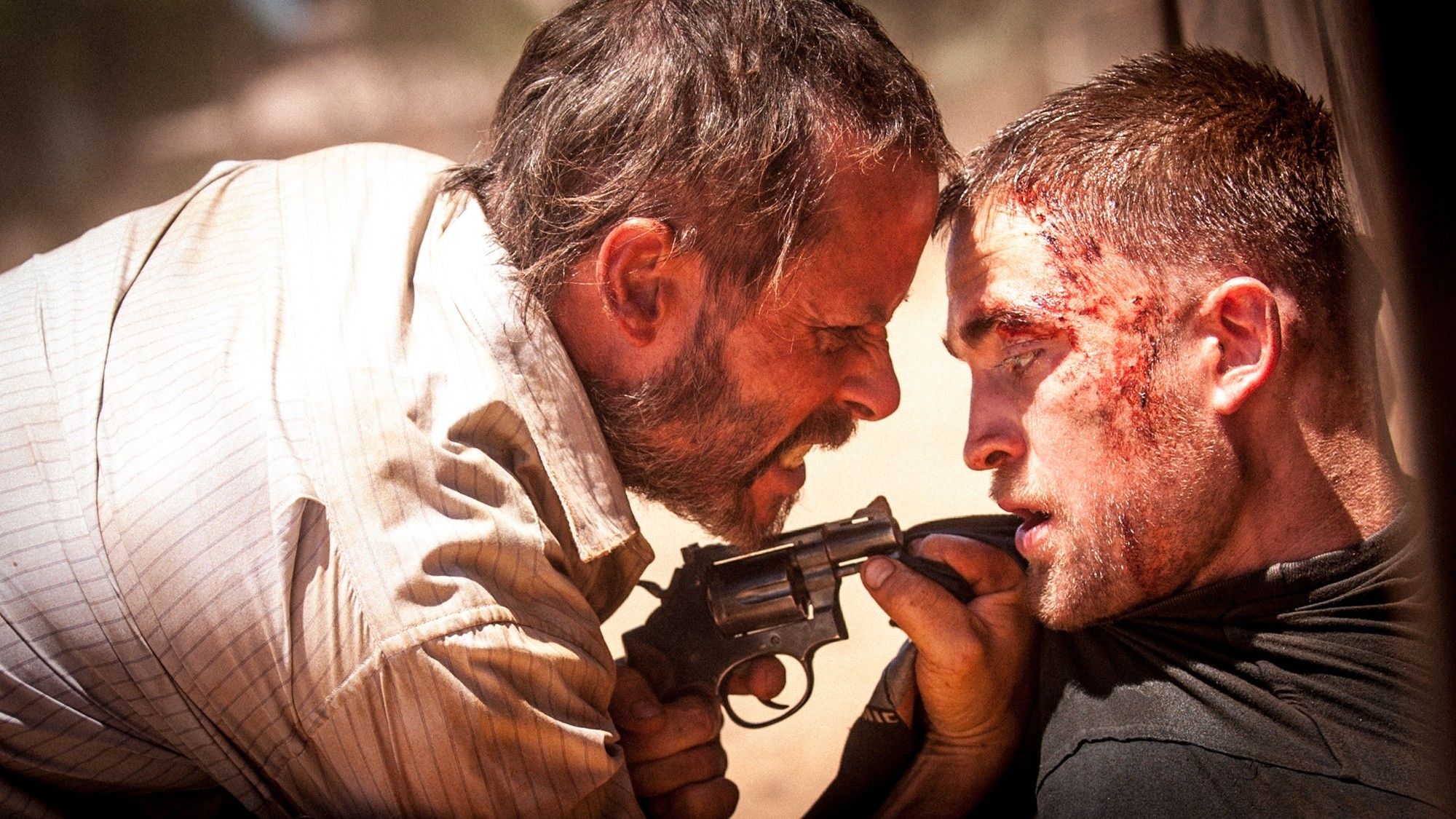 Guy Pearce stars as Eric and Robert Pattinson stars as Reynolds in A24's The Rover (2014)