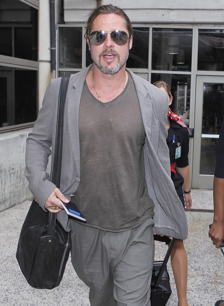 Brad Pitt Arrives at LAX Airport Pulling His Own Suitcase