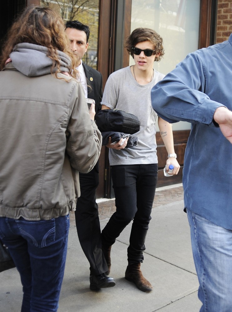 Harry Styles Carrying A Toiletry Bag, Is Seen Leaving The Hotel That He and Taylor Swift Arrived