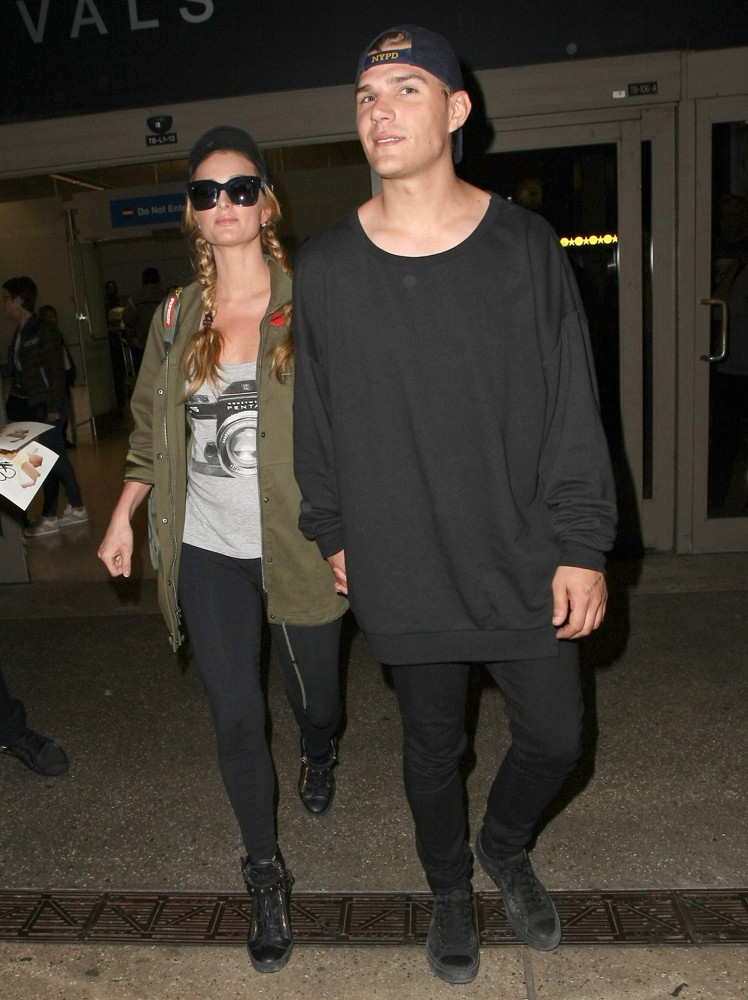 Paris Hilton Arrives at Los Angeles International Airport with Chris Zylka