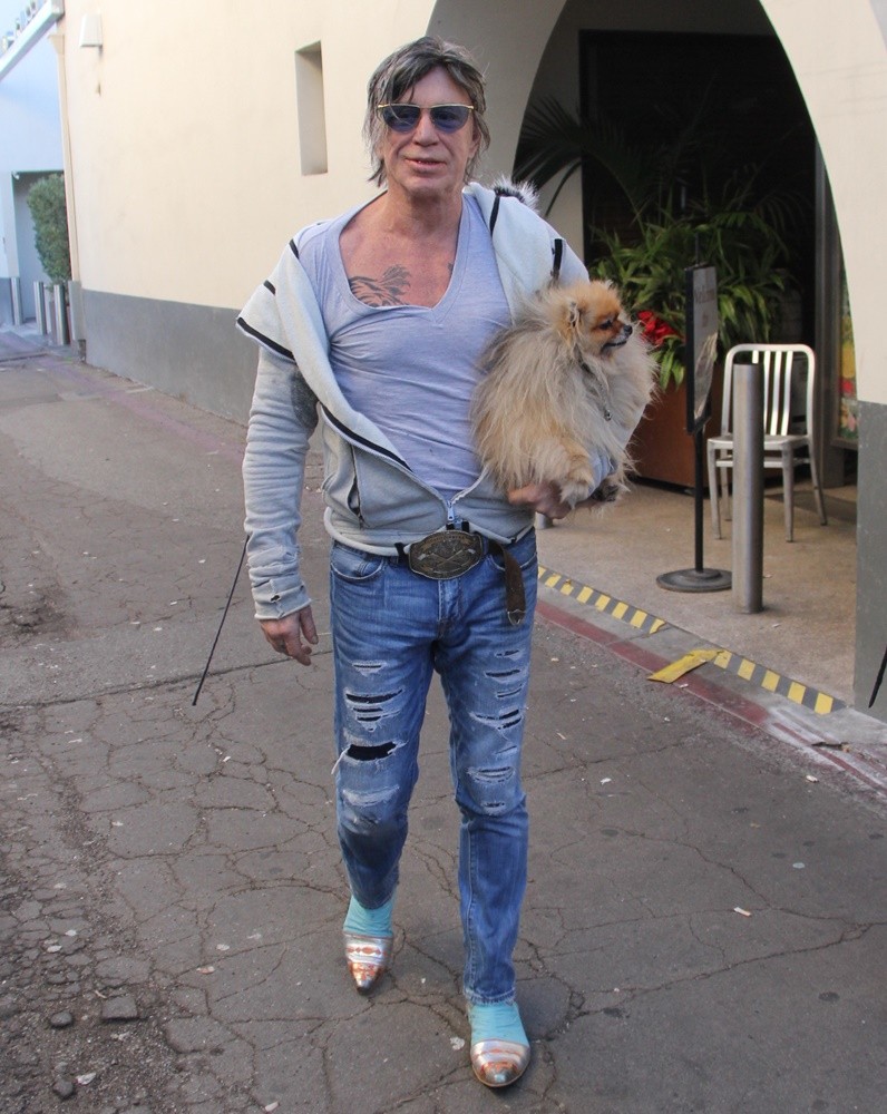 Mickey Rourke Carries His Pet Dog as He Leaves Cafe Roma on Christmas Eve