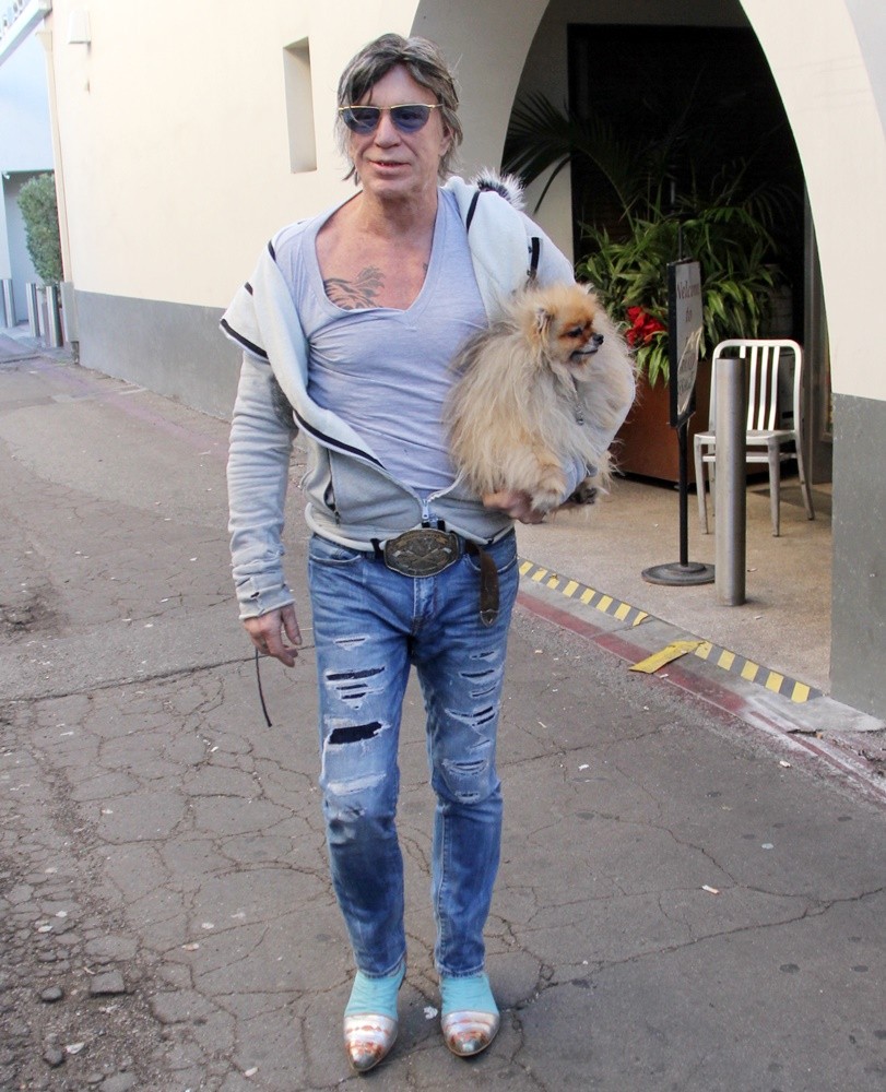 Mickey Rourke Carries His Pet Dog as He Leaves Cafe Roma on Christmas Eve