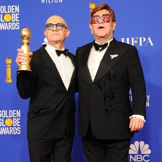 Bernie Taupin, Elton John in 77th Annual Golden Globes - Press Room