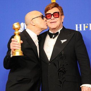 Bernie Taupin, Elton John in 77th Annual Golden Globes - Press Room