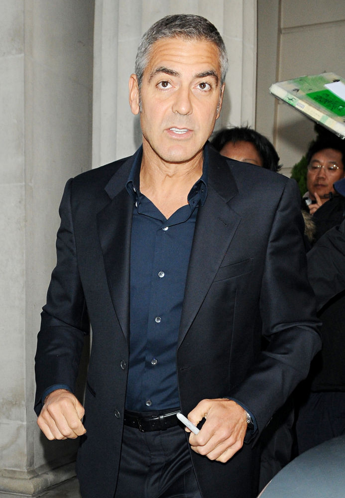 George Clooney Blessed by Woman With Spit